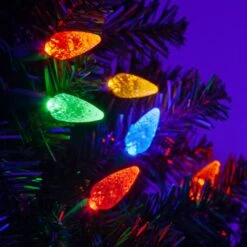 C6 Multi Color LED String Lights 70 Lights, 24 Feet -Xmas Lights Store C6 Multicolor LED String Lights Tree Closeup 5680