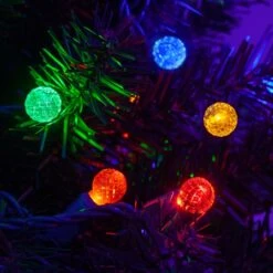 G12 Multi Color LED String Lights 70 Lights, 24 Feet -Xmas Lights Store G12 Multi LED String Lights Tree CLoseup 4564
