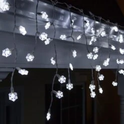 Snowflake Cool White LED Icicle Lights 7 Ft. Lighted Length, 70 Lights -Xmas Lights Store LED snowflake icicle lights 50591 A